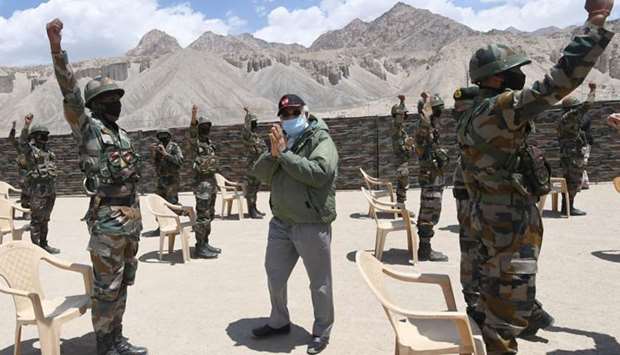 India's Prime Minister Narendra Modi gestures as he interacts with army soldiers during his visit to Himalayan region of Ladakh