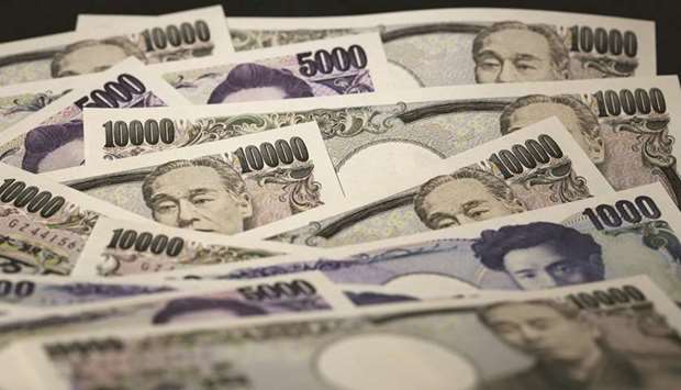 Japanese yen banknotes of various denominations are arranged for a photograph in Tokyo. Despite the slump in US yields this year, the yen is up just 1% against the greenback to around the 107.50 level, and slipped 0.4% in the second quarter.
