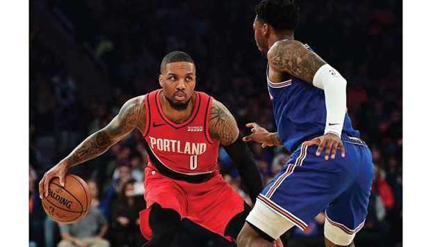 The Portland Trail Blazersu2019 Damian Lillard (left) in action against the New York Knicks during a regular NBA game at Madison Square Garden in New York on January 1, 2020. (TNS)
