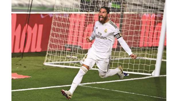 Real Madridu2019s Sergio Ramos celebrates after scoring against Getafe during the La Liga match in Valdebebas. (AFP)