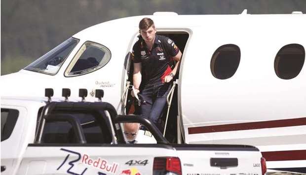 Red Bull driver Max Verstappen leaves the aircraft upon his arrival to the military airport Hinterstoisser in Zeltweg ahead of the Austrian Grand Prix in Spielberg, Austria, yesterday. (AFP)