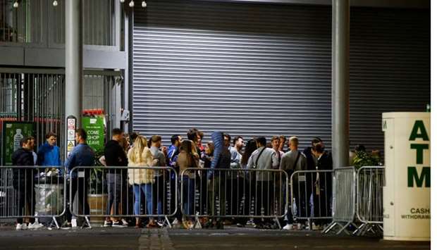People are seen at the Borough Market, as the outbreak of the coronavirus disease continues, in London, Britain