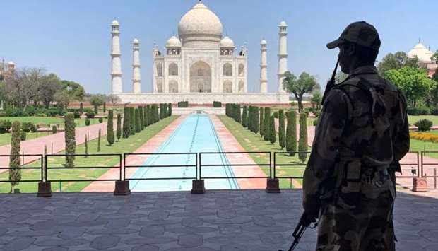 A member of Central Industrial Security Force (CISF) personnel stands guard inside the empty premises of the historic Taj Mahal during a 21-day nationwide lockdown to slow the spread of Covid-19, in Agra on April 2.