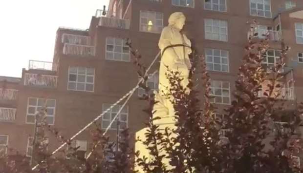 Protesters pull down the statue of Christopher Columbus in Baltimore, Maryland, US, in this still image obtained from a social media video. Spencer Compton/via REUTERS