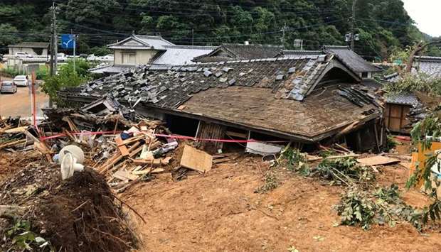 A general view shows a collapsed house following a landslide caused by torrential rain in Ashikita, Kumamoto prefecture