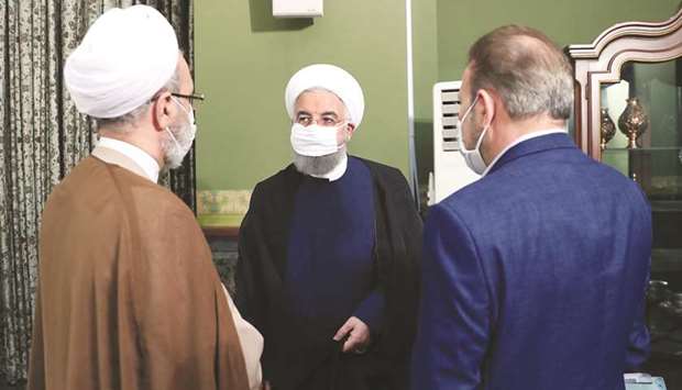 A handout picture made available by the Iranian presidency yesterday shows President Hassan Rouhani (centre), wearing a face mask at a cabinet session in Tehran yesterday.