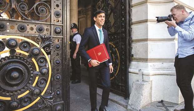 Rishi Sunak, UK Chancellor of the Exchequer, walks in Downing Street in London. Sunak prepares to give a statement on Wednesday outlining measures to help stimulate the economy and protect jobs as the country emerges from a national lockdown that began March 23.