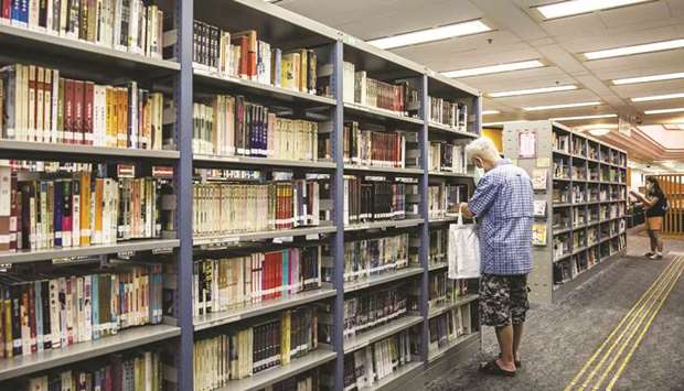 A man looks at books in a public library in Hong Kong yesterday.
