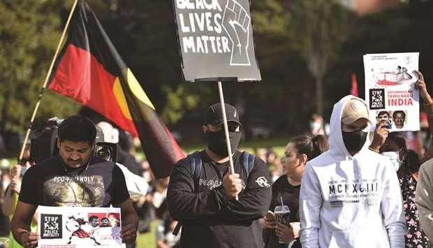 Demonstrators take part in a Black Lives Matter protest in Sydney to call for an end to Aboriginal deaths in custody in Australia.