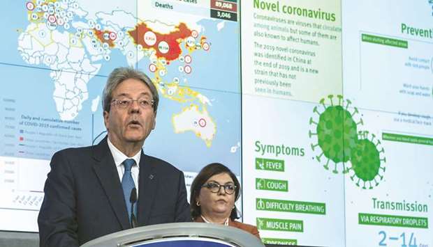 Paolo Gentiloni, Financial Affairs Minister for the European Commission, speaks beside Adina Valean, Commissioner of Transport for the European Commission, during a news conference in Brussels on March 2. Gentiloni told a news conference yesterday that to reduce risks of a second recession EU fiscal rules could remain frozen even after growth returns next year.