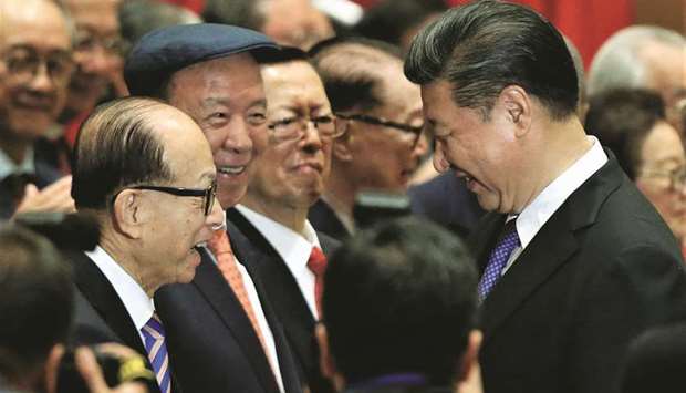 Li with Xi Jinping (right), marking the 20th anniversary of Hong Kongu2019s handover from Britain to China, in June 2017 (file). Li Ka-shing, who built Hong Kongu2019s biggest fortune by straddling the divide between China and the West, is now finding it harder than ever to keep both sides happy. As Beijing spars with western governments on everything from Hong Kong to trade and the coronavirus, the 91-year-old billionaireu2019s business empire has become an important test case for whether international companies can navigate what many are calling a new Cold War.