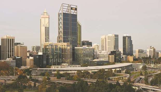 Buildings stand at dusk in Perth. Since 2000, Australia has added about 6mn to its population, more than six times the growth seen in Germany, with most of that coming from immigration. That fuelled huge demand for housing construction, much of it smaller dwellings in larger, higher-density urban blocks, not just the bungalows on sprawling plots for which Australian suburbs are better known.