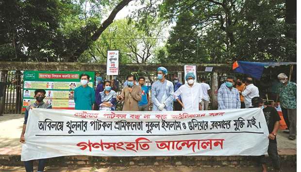 Leftist party activists take part in a rally demanding immediate release of two arrested jute mill union leaders, in Dhaka yesterday.