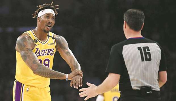 Dwight Howard (left) of the Los Angeles Lakers argues his foul call with referee David Guthrie during a regular NBA game at Staples Center on February 21, 2020. (AFP)