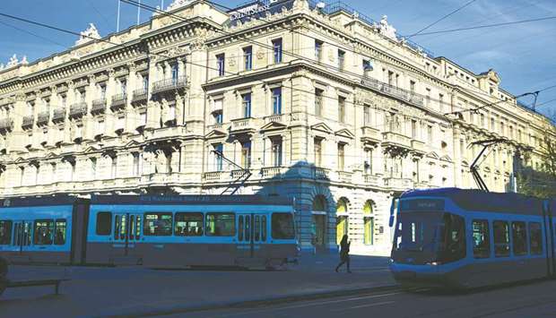 Trams pass the headquarters of Credit Suisse Group in Zurich. China has gained in relevance for Credit Suisse and other international banks after Beijing fast-tracked the opening of its financial markets to foreigner investors.