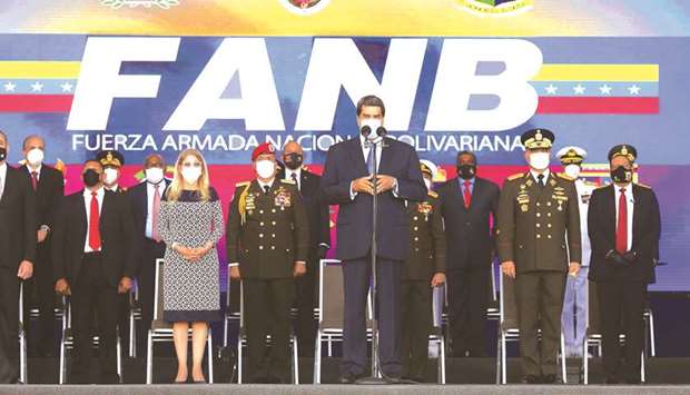 Venezuelau2019s President Nicolas Maduro delivers a speech next to Venezuelan Defence Minister Vladimir Padrino Lopez (right) during the promotion ceremony of members of the Bolivarian National Armed Forces at the military school in Caracas, amid the coronavirus pandemic.