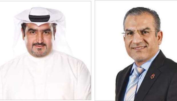 Abdulaziz al-Babtain, chief business officer, Ooredoo Kuwait.  and  Adel al-Daylami, chief Global Business officer, Batelco.