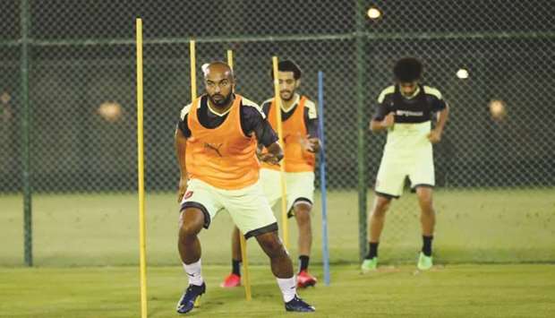 Al Duhailu2019s Ali Afif trains with teammates yesterday.