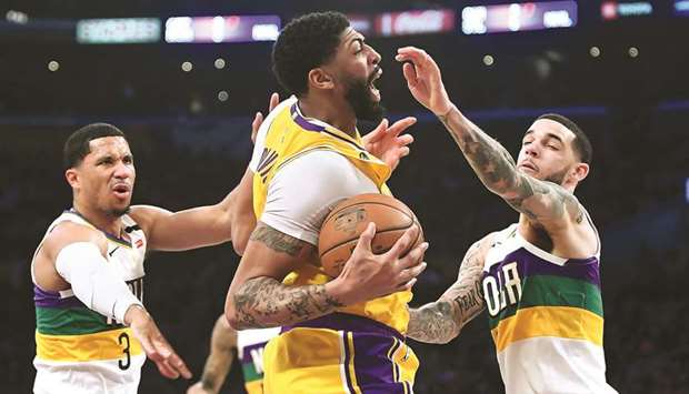 The Los Angeles Lakersu2019 Anthony Davis (middle) in action against the New Orleans Pelicans during a regular NBA game at Staples Center in Los Angeles on February 25, 2020. (TNS)