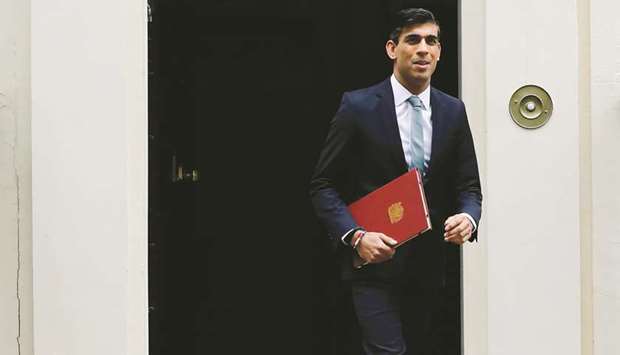 Chancellor of the Exchequer Rishi Sunak leaves 11 Downing street in central London yesterday.