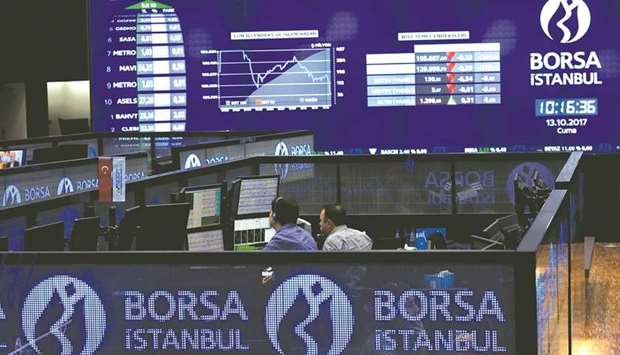 Traders work at their desks on the floor of the Borsa Istanbul in Istanbul (file). Local equity-market accounts have climbed by 33% in about a year to 1.56mn, according to data from Turkeyu2019s Central Securities Depository.