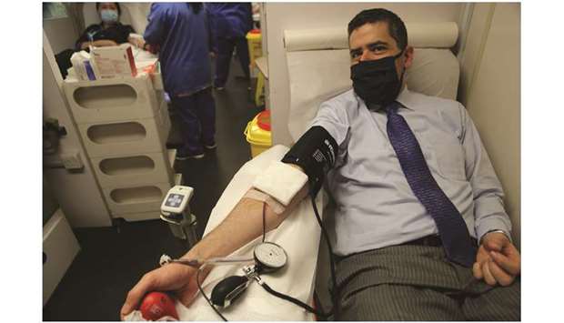 Dr Jason Ford donating blood.