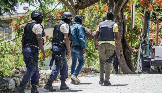 Police are on the lookout for others suspected assassins of Haitian President Jovenel Moise outside the Embassy of Taiwan in Port-au-Prince, Haiti on July 9