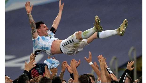 Argentina's Lionel Messi is thrown into the air by teammates after winning the Conmebol 2021 Copa America football tournament final match against Brazil at Maracana Stadium in Rio de Janeiro, Brazil. AFP