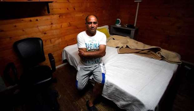 Balbir Singh who denounced his corporals sits on a bed in his house in the coastal city of Sabaudia, South of Rome on June 24