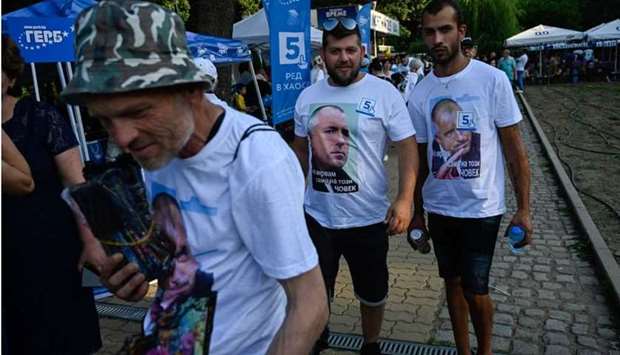Supporters wearing tee-shirts with the portrait of former Bulgaria's Prime Minister and leader of centre-right GERB party Boyko Borisov take part of a pre-election rally on July 9. AFP