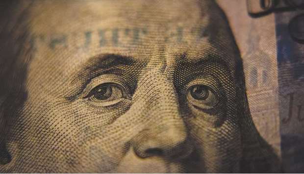 HIGH TIDE: A close-up of a US $100 bill.
