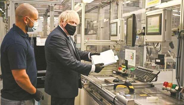 British Prime Minister Boris Johnson visits the Envision battery manufacturing facility at the Nissan production plant in Sunderland, north east England, yesterday. Nissan cast its backing for the 9  gigawatt-hour (GWh) plant as illustrative of a rejuvenation of Britainu2019s automotive industry, which has for five years grappled with the fear that Brexit could cut off the rest of the European market.