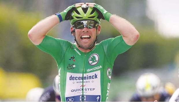 Team Deceuninck Quickstepu2019s Mark Cavendish of Great Britain celebrates as he crosses the finish line of the 6th stage of the 108th edition of the Tour de France yesterday. (AFP)