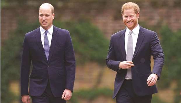 Princes William and Harry at the unveiling of a statue they commissioned of their mother Diana, Princess of Wales, in the Sunken Garden at Kensington Palace, London.