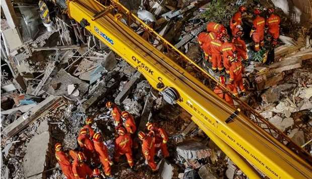 Rescuers searching at the site of a hotel after it collapsed leaving at least one dead and 10 others missing in the city of Suzhou in China's eastern Jiangsu province.