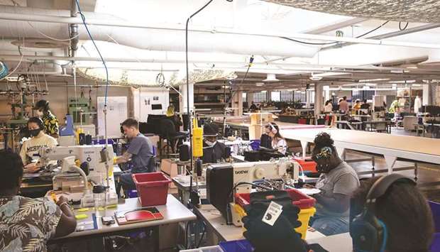 Workers sew a batch of Carhartt hats at the Industrial Sewing & Innovation Center manufacturing facility in Detroit, Michigan. US producer prices surged in June, leading to the largest annual gain in more than 10-1/2 years, suggesting inflation could remain high as robust demand fuelled by the economyu2019s recovery from the Covid-19 pandemic strains the supply chain.