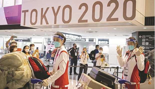 Chinau2019s table tennis players arrive for the Tokyo 2020 Olympic Games at Narita International Airport in Narita. (AFP)