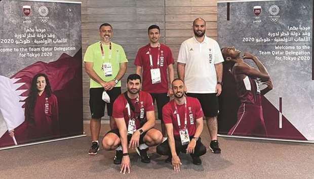 Qatar Olympic Committee Secretary General HE Jassim bin Rashid al-Buenain (centre) with other officials at the Olympic Village in Tokyo on Sunday.