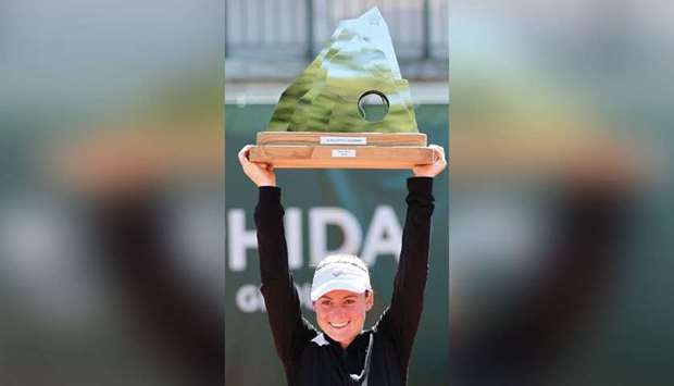 Sloveniau2019s Tamara Zidansek lifts the trophy after her victory over Franceu2019s Clara Burel in the Lausanne WTA tournament final in Lausanne yesterday. (AFP)