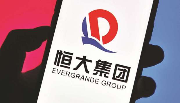 Evergrande Group logo is seen displayed on a smartphone. Investor doubts over Evergrande intensified yesterday as a creditoru2019s successful demand to freeze some assets underscored concern that the embattled developer may struggle to raise funds.