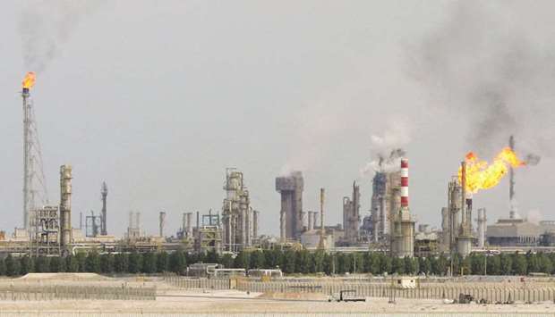 File photo taken on February 1, 2006 shows an oil refinery on the outskirts of Doha. A robust expansion in the extraction of hydrocarbons and desalination as well as in the production of refined petroleum products, basic metals, chemicals and beverages led Qatar's industrial production to surge 6% month-on-month this May, according to the PSA.