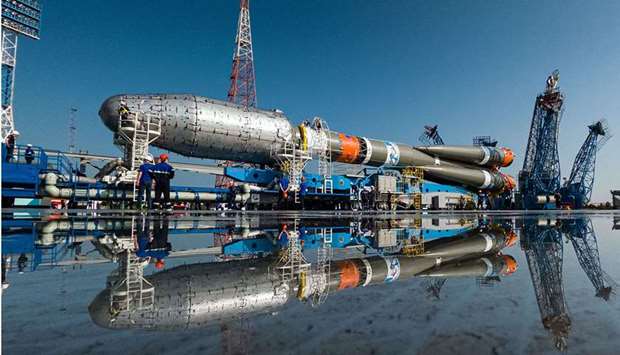 A Soyuz-2.1b rocket booster with a Fregat upper stage and satellites of British firm OneWeb is seen at a launchpad at the Vostochny Cosmodrome in Amur Region, Russia