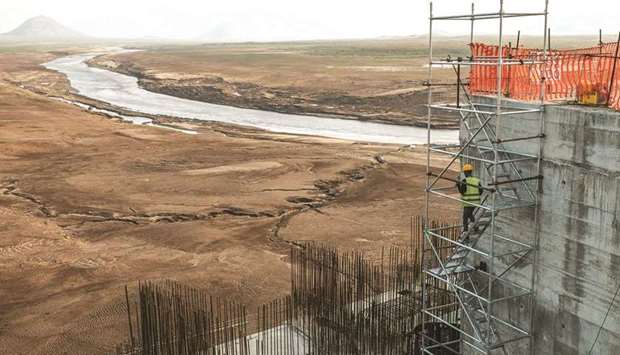 File photo taken on December 26, 2019, shows a worker go down a construction ladder at the Grand Ethiopian Renaissance Dam (GERD), near Guba in Ethiopia.