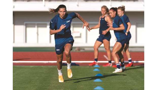 US players train at the Tokyo Stadium yesterday, on the eve of their football match against Sweden.