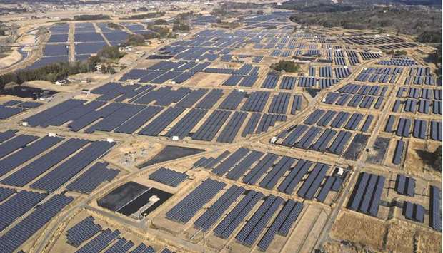 A solar farmu2019s photovoltaic panels stand on former farmland in the Yatsuda district of Namie, Fukushima Prefecture, Japan. Renewable energy, which includes solar, wind and hydropower, should make up more than a third of the nationu2019s power generation by the fiscal year starting April 2030, according to a draft report released yesterday.