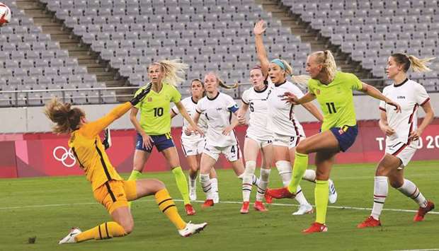 Swedenu2019s Stina Blackstenius (second right) scores against USA during the womenu2019s Group G first round match at the Tokyo Stadium in Tokyo yesterday. (AFP)