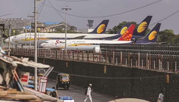 Jet Airways and SpiceJet aircraft at Chhatrapati Shivaji Maharaj International Airport in Mumbai. The recent surge in the Covid-19 pandemic has dealt a severe blow to Indiau2019s economy, and its airline industry has particularly been one of the sectors most affected.
