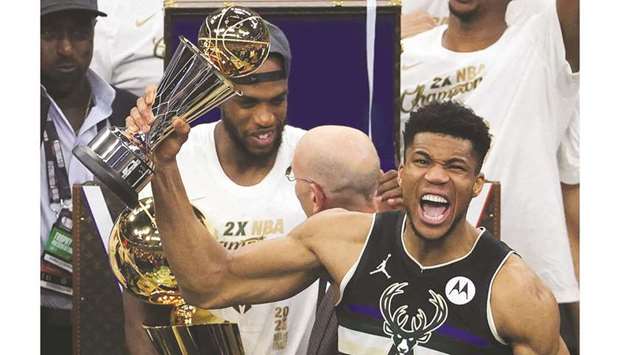 Giannis Antetokounmpo of the Milwaukee Bucks celebrates winning the NBA Finals MVP Award after defeating the Phoenix Suns in Game Six to win the 2021 NBA Finals in Milwaukee, Wisconsin. (Getty Images/AFP)