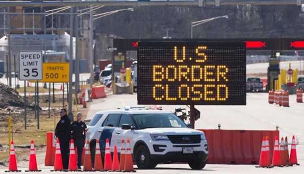 The US government has extended the closure of land borders with Canada and Mexico to non-essential travel such as tourism through August 21. (AFP)