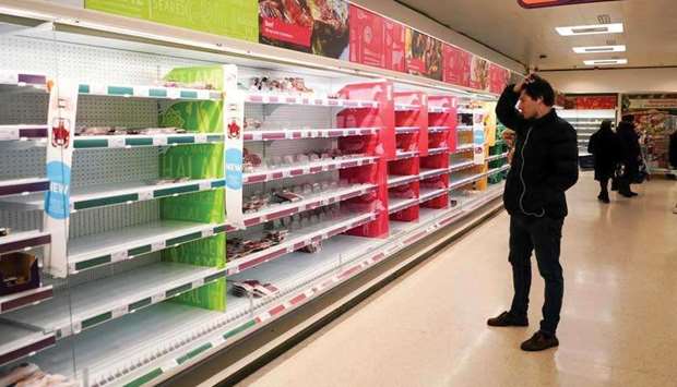 (File photo) A man stands next to shelves empty of fresh meat in a supermarket, as the number of worldwide coronavirus cases continues to grow, in London, Britain, recently. (REUTERS)